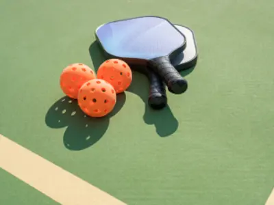 pickleball bats on green background