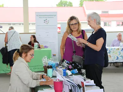 Senior Looking at vendor table