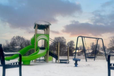 Map play equipment in park in winter