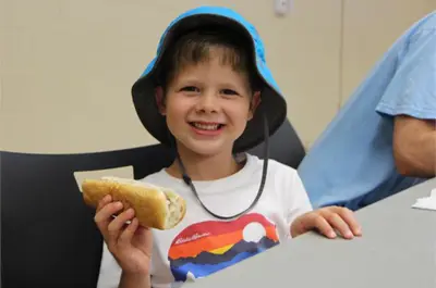 Child eating hotdog