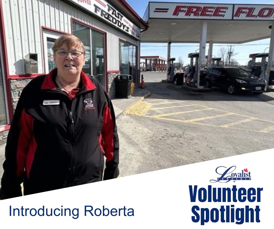 Smiling woman outside a service station